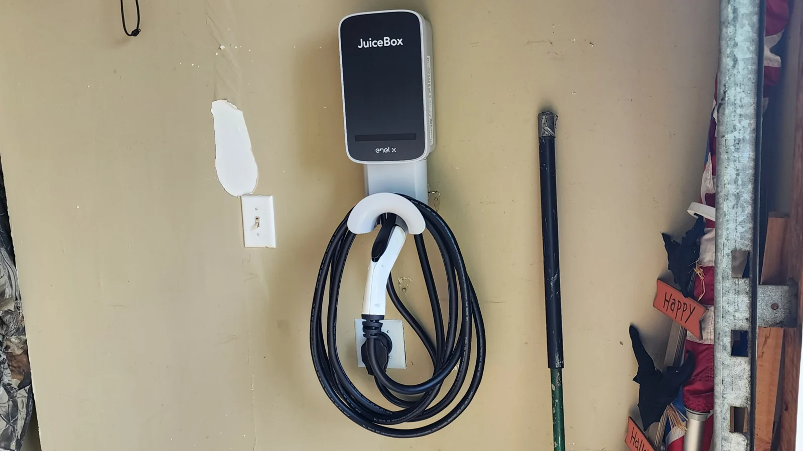 Autel charging station mounted on a garage wall