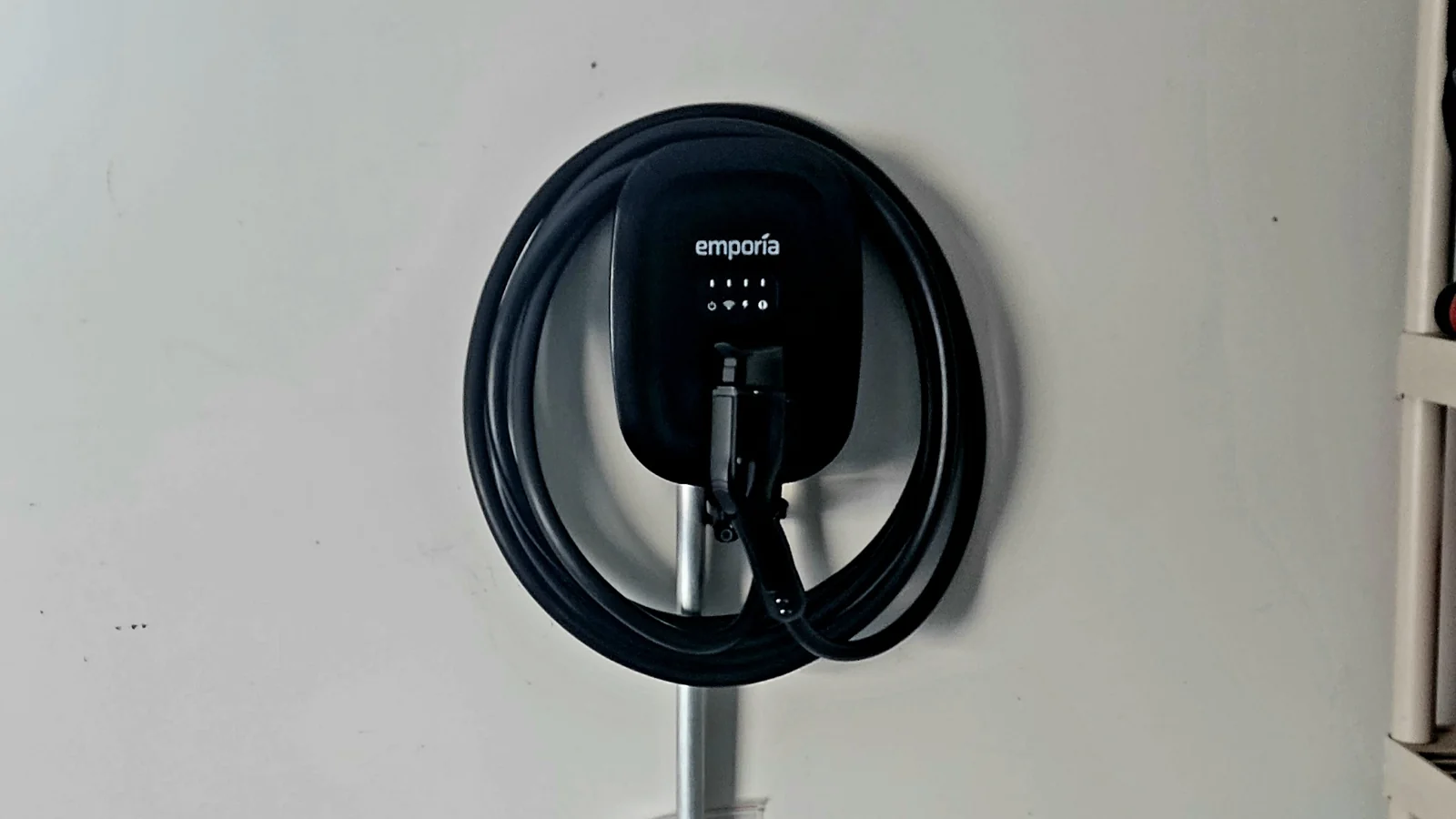 Emporia EV charger and neatly arranged charging cable