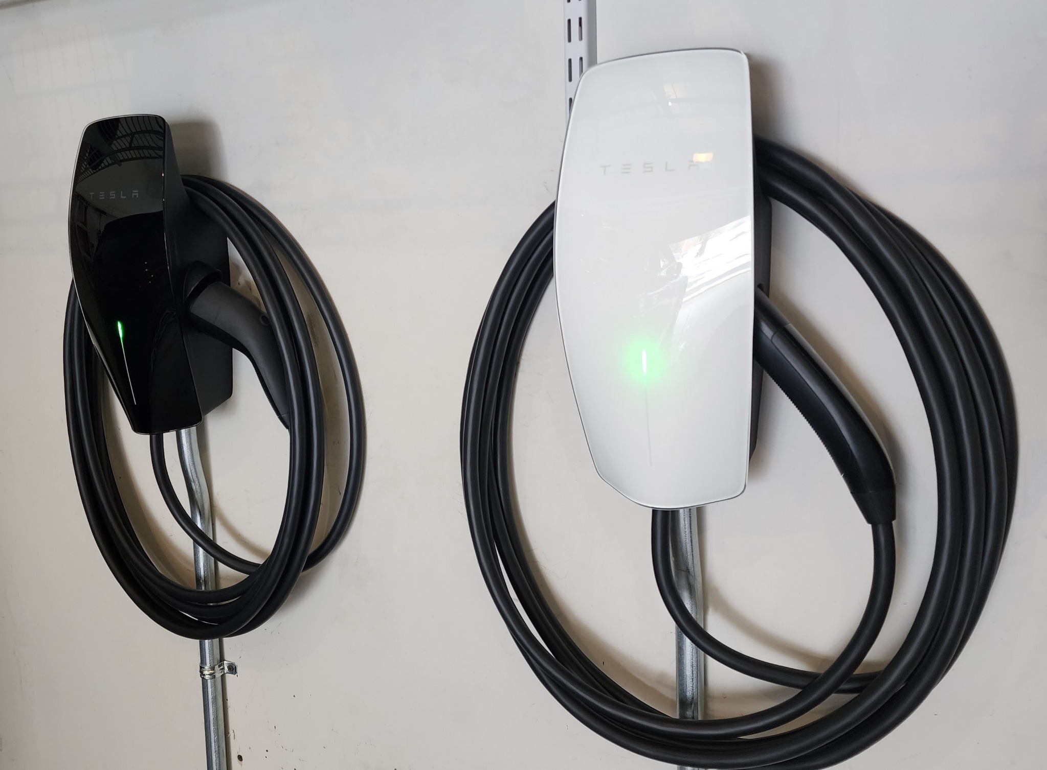 Two Tesla Wall Connectors installed side by side by Real Electric